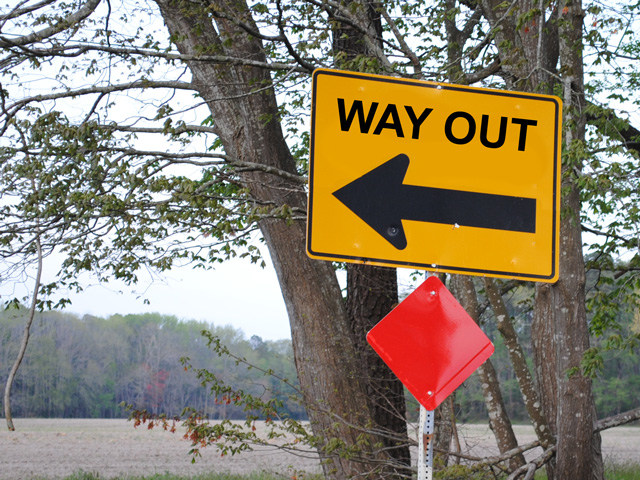 It can be daunting to hand over controls to a business you&#039;ve built, so most owners establish a time line for gradual transition. (DTN photo illustration by Nick Scalise; road sign photo by Lee Cannon, CC BY-SA 2.0)